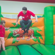Bouncing on a bouncy castle at lymphoedema adventure wales day