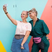 TwoWomenSelfieColouredWall.JPG