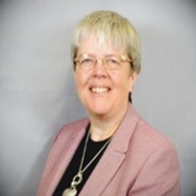 person with a pink jacket and glasses